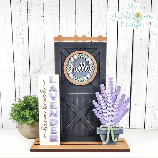 Decorative sign with 'Hello' and 'Lavender' text, potted plant, and wooden stand on a white background.