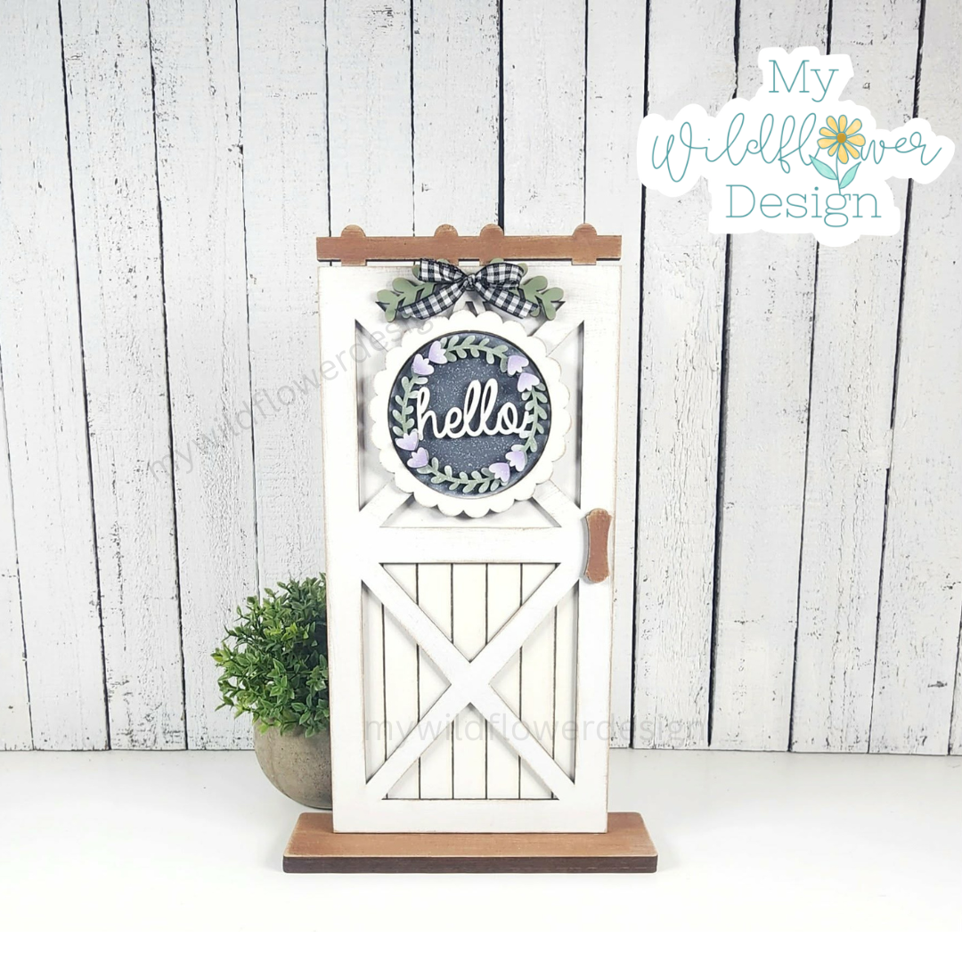 Decorative wooden gate with 'Hello' sign on a white background, featuring 'My Wildflower Design' branding.