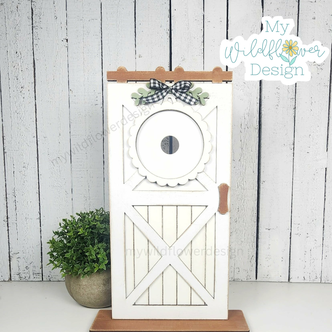 Decorative wooden owl door with a bow on a white background, featuring 'My Wildflower Design'.